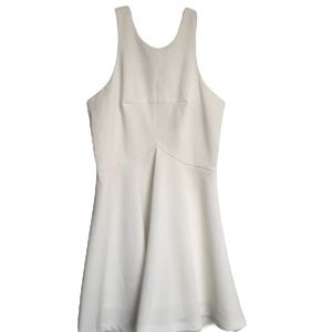 White dress with cutout back and full skirt.